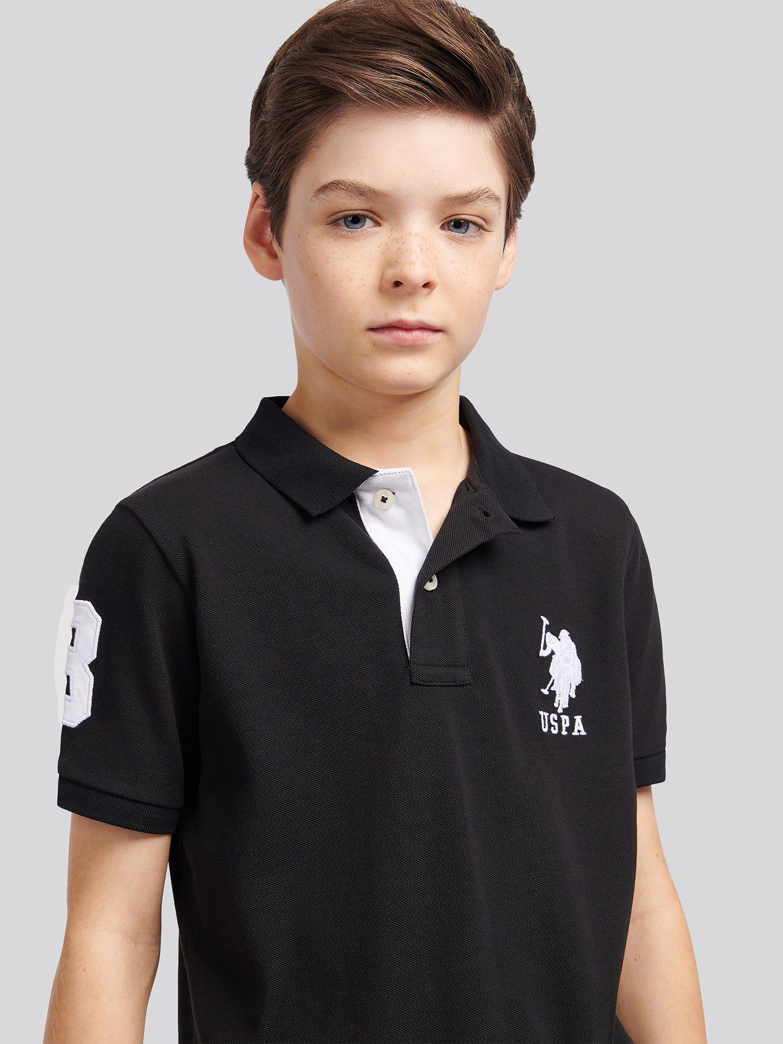 Boys Player 3 Polo Shirt in Black Bright White DHM - Image 2