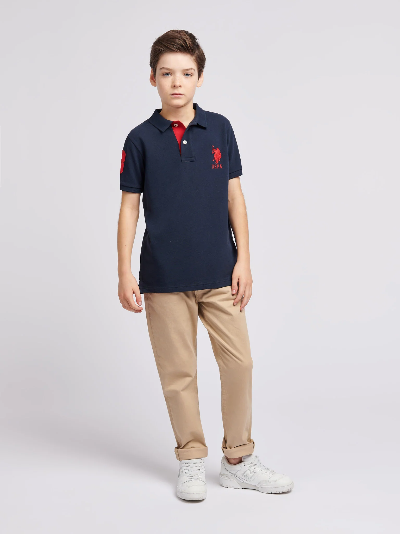Boys Player 3 Polo Shirt in Dark Sapphire Navy / Haute Red DHM - Image 3