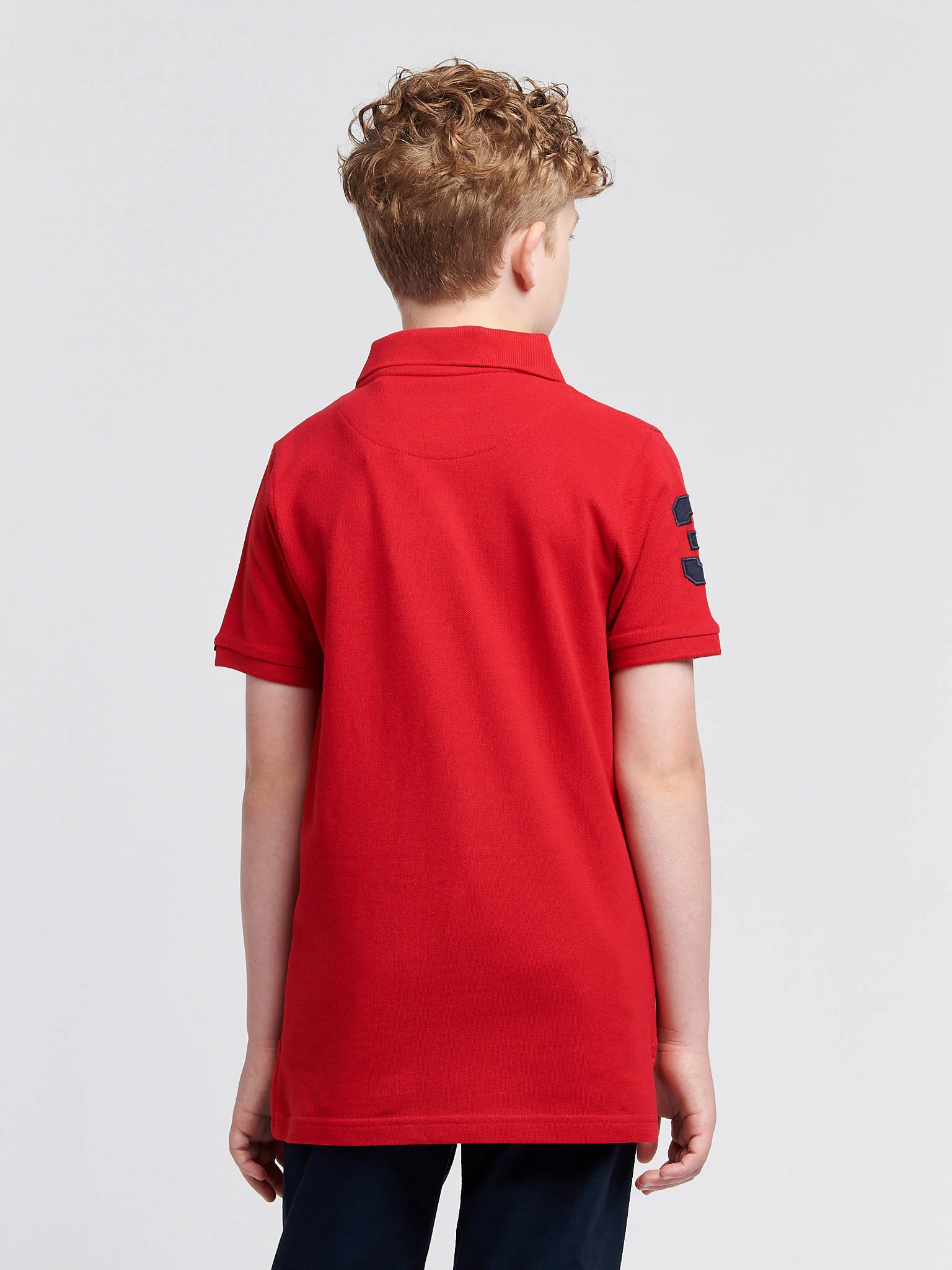Boys Player 3 Polo Shirt in Haute Red - Image 4