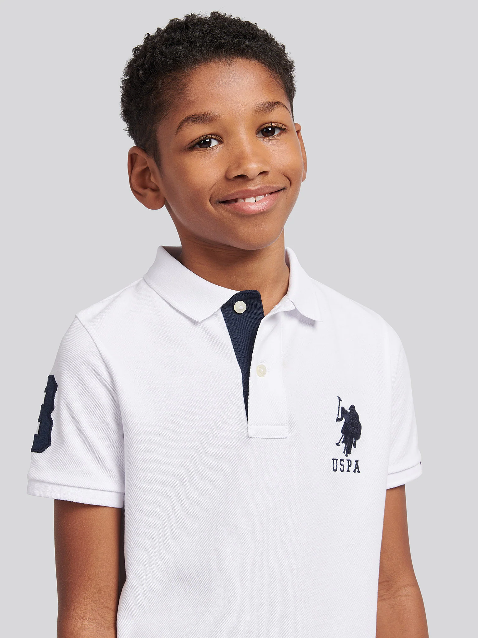 Boys Player 3 Polo Shirt in White / Dark Sapphire Navy DHM - Image 2
