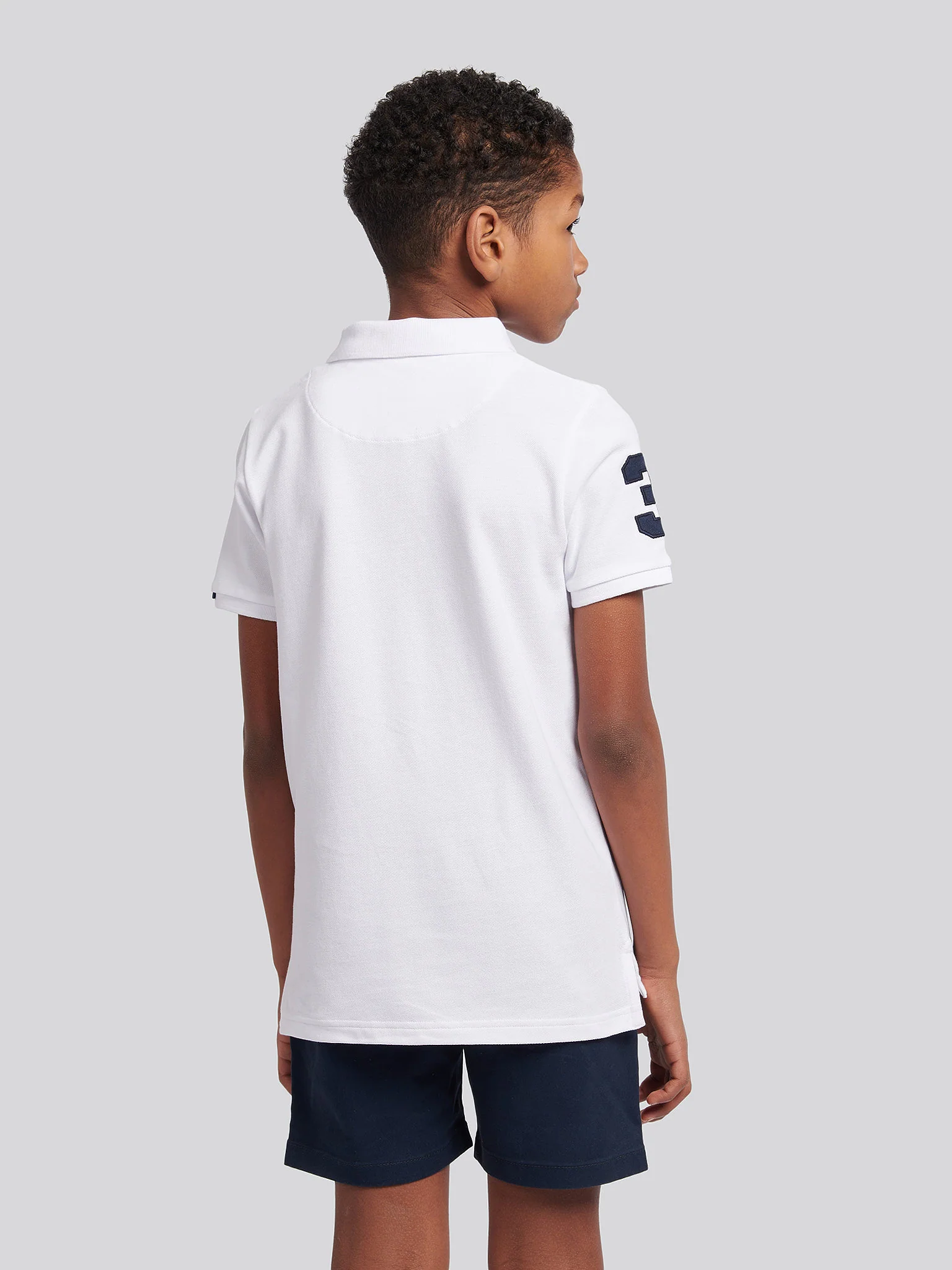 Boys Player 3 Polo Shirt in White / Dark Sapphire Navy DHM - Image 4