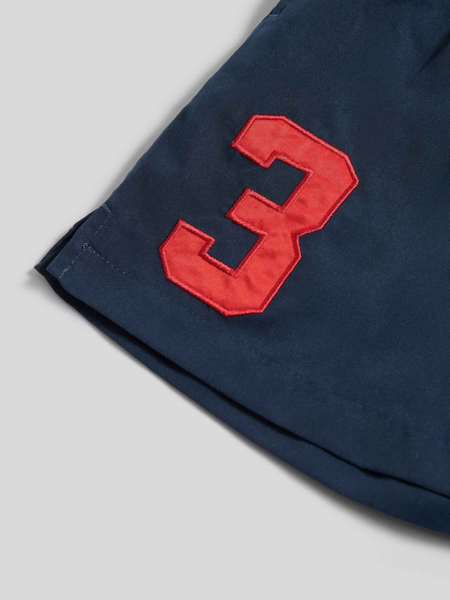 Boys Player 3 Swim Short in Dark Sapphire Navy / Haute Red DHM - Image 7