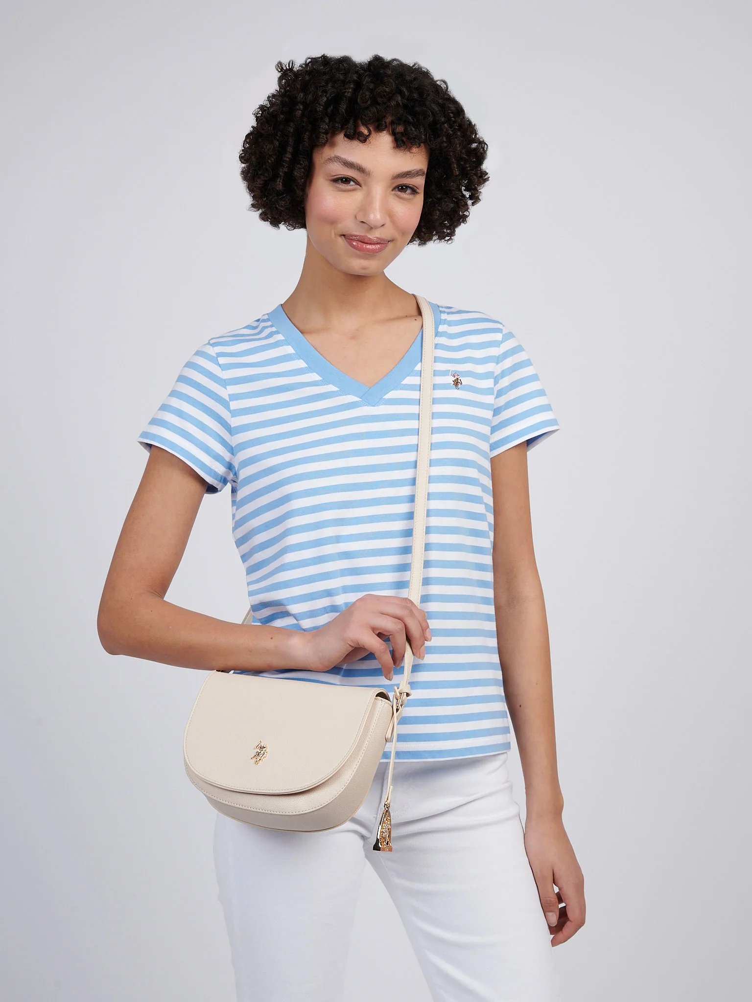 U.S. Polo Assn. Womens Jones Flap Crossbody Bag in Powder