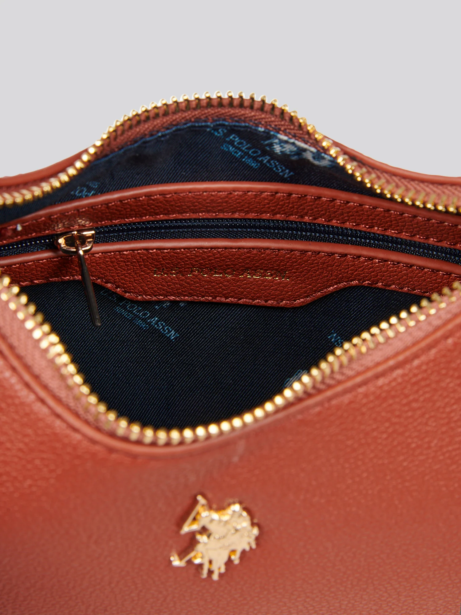 U.S. Polo Assn. Womens Jones Small Round Hobo Bag in Rust - Image 7